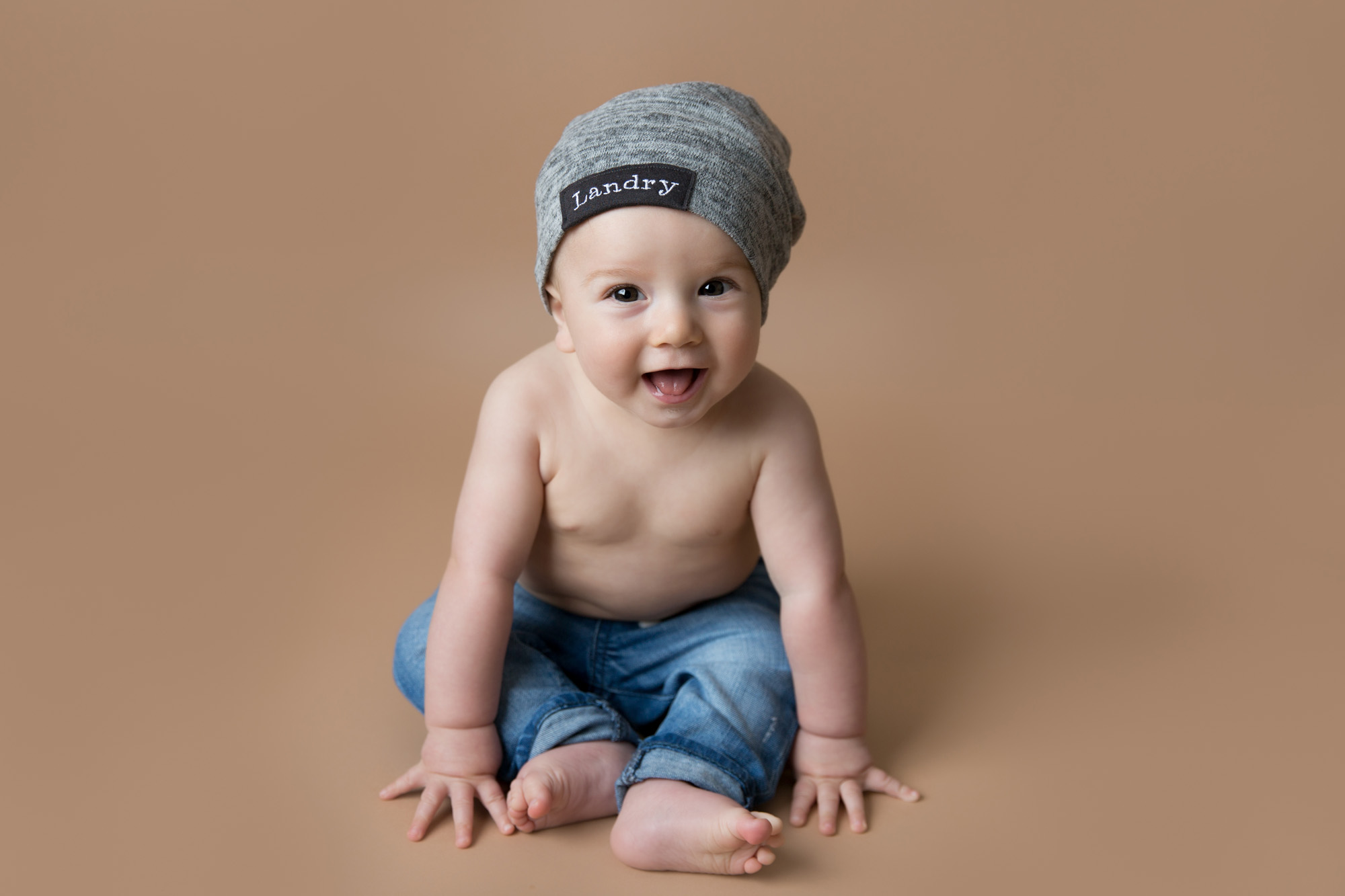 Smiling boy during 6 month milestone session taken by DMV newborn photographer Sarah Botta Photography in Woodbridge, VA studio
