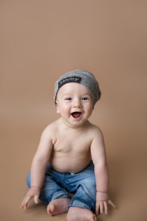 Smiling boy during 6 month milestone session taken by DMV newborn photographer Sarah Botta Photography in Woodbridge, VA studio