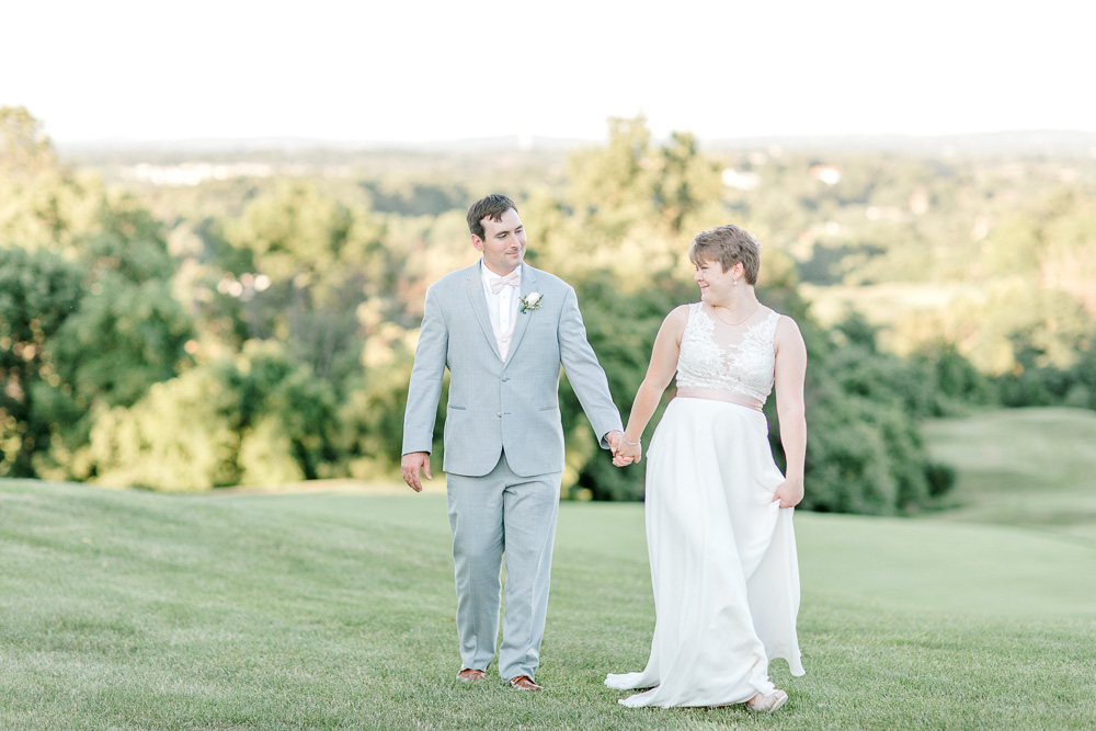 Bride and groom holding hands at Stoneleigh Golf Club Wedding with Virginia Wedding Photographer Sarah Botta Photography