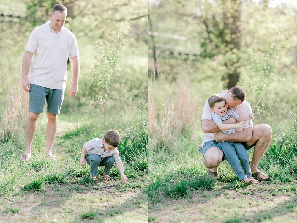 Maternity session outdoors with Sarah Botta Photography. Father and young son laughing and hugging surrounded by trees.
